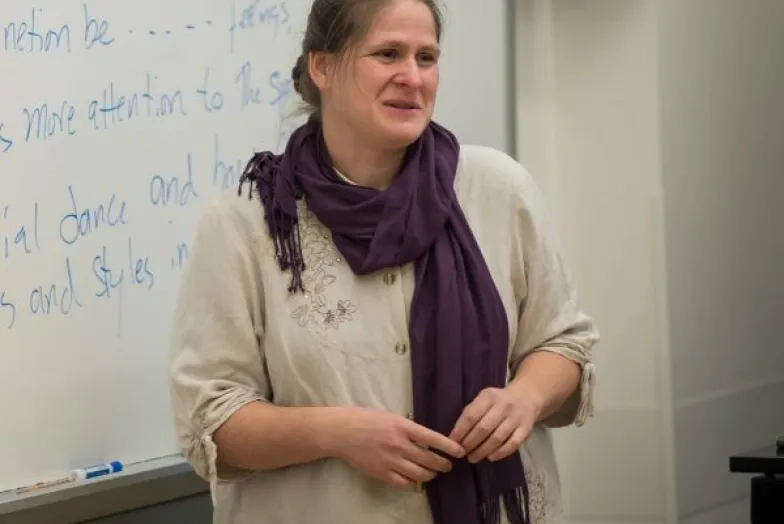 Melita Denny headshot while lecturing