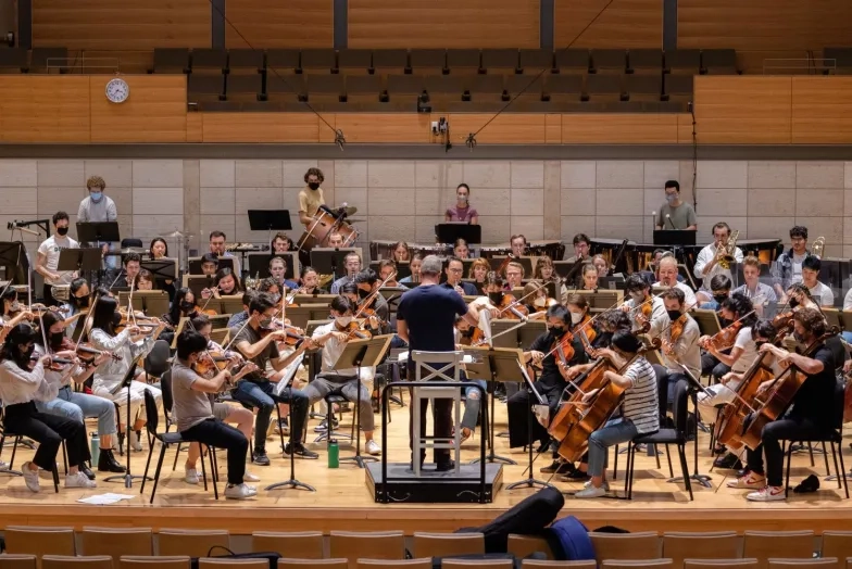 a rehearsal for orchestra in the concert hall