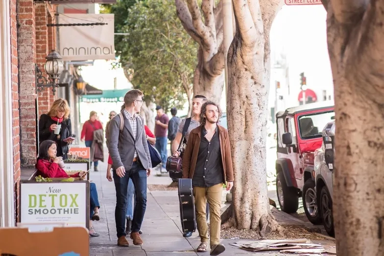 SFCM students walk in Hayes Valley holding their instruments