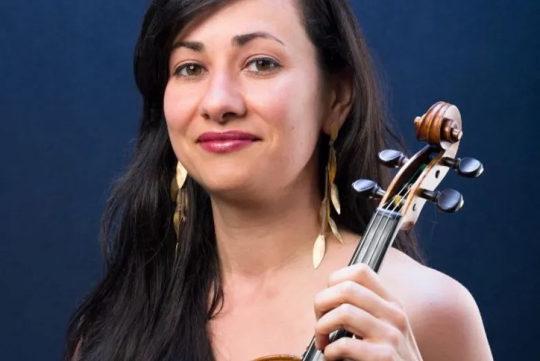 Natasha Makhijani Headshot with instrument
