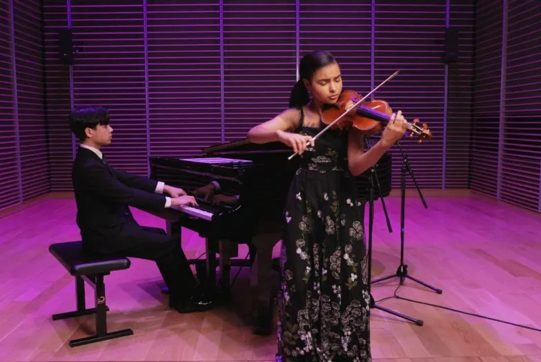 Parker Van Ostrand and Amaryn Olmeda perform inside Studio G of SFCM's Bowes Center.