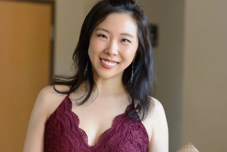 Chia-Lin Yang holding flowers after a performance