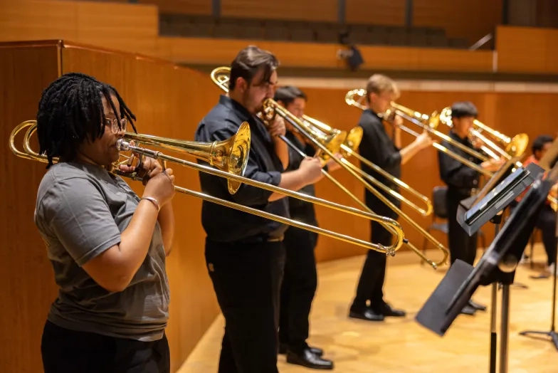 The Chromatic Brass Collective rehearses alongside students. The Chromatic Brass Collective rehearses alongside students.