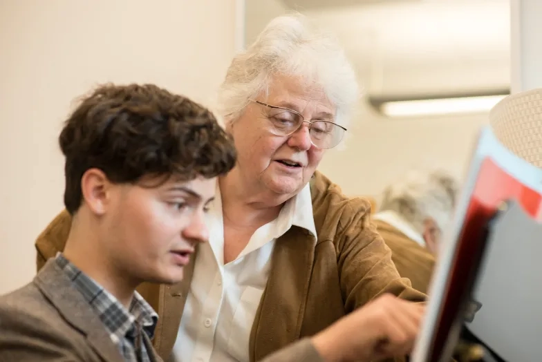 Elinor Armer works with a student.