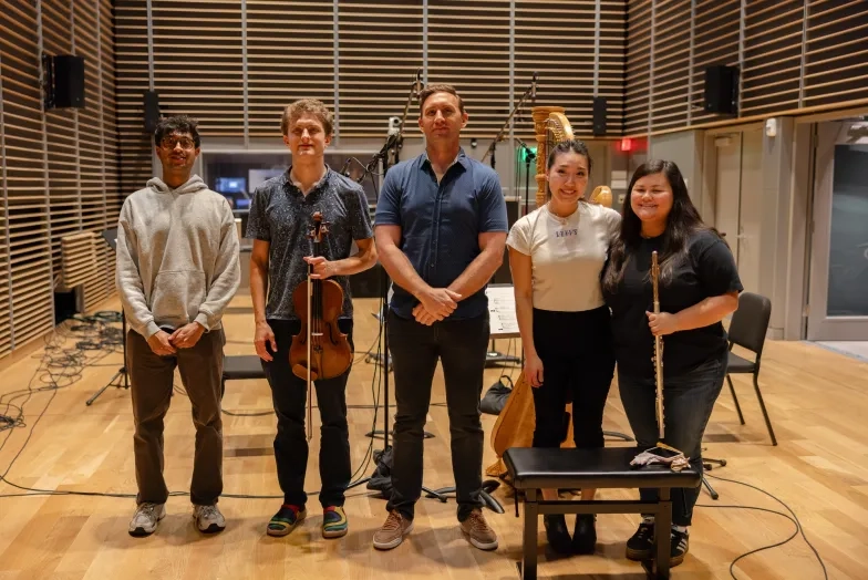 2025 KDFC Sound Logo Competition winners Ansh Patel (far left) and Aaron Pike (middle) with the students who recorded their work.