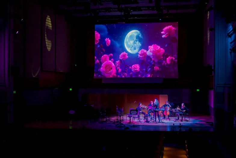 A TAC recital using projection technology.