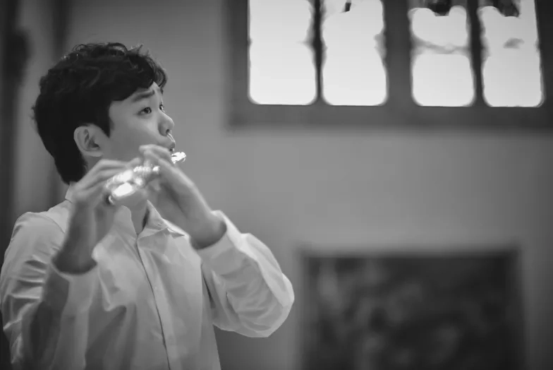 Yubeen Kim playing a flute