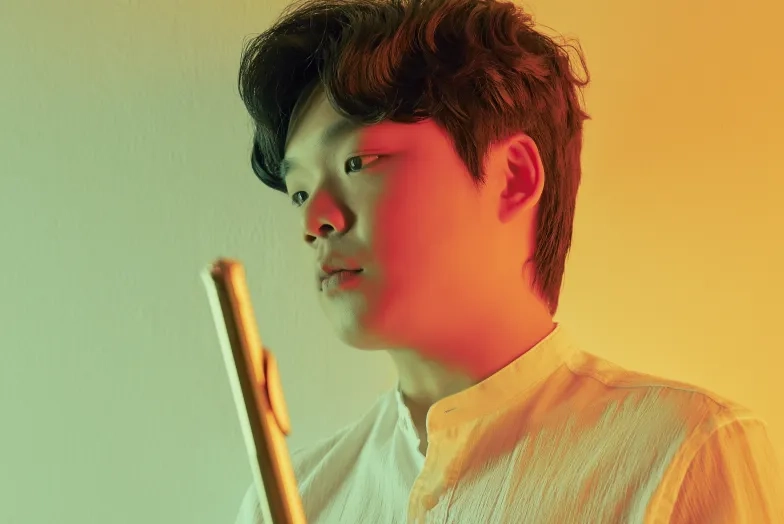 Yubeen Kim holding a flute