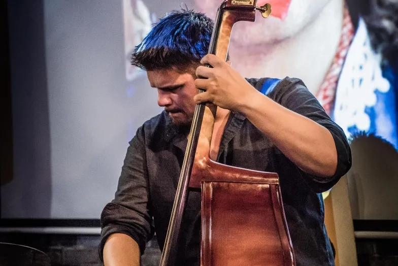 Marcos Varela plays upright bass Marcos Varela plays upright bass