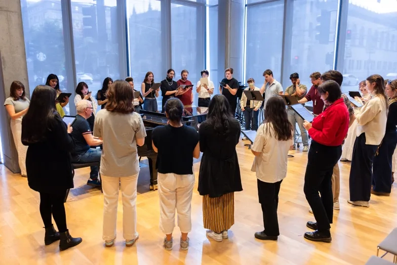 Students rehearse with Askonas Holt artis Craig Terry at piano.