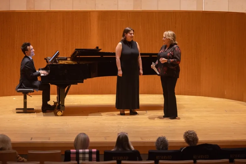 Student Lanie Anthan works with Pat Racette.