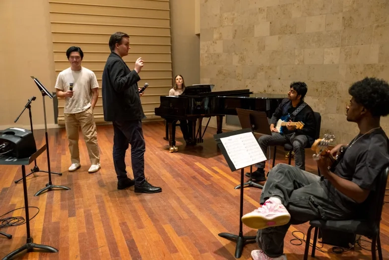 Olivia Flanigan (seated) and her Contemporary Vocal Craft class.