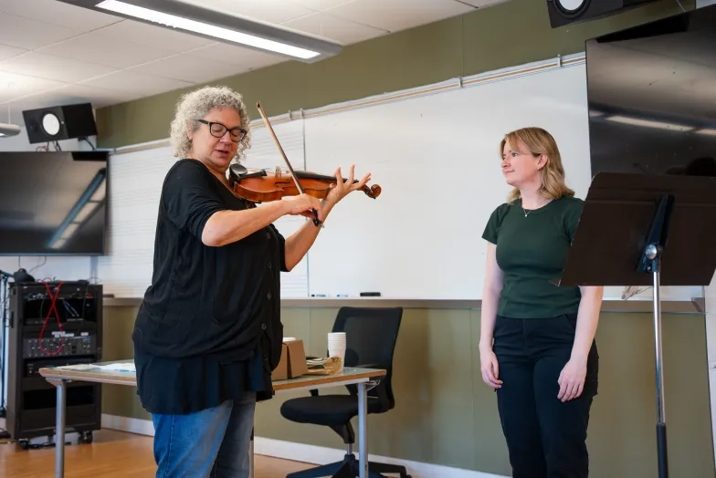 Kay Stern with a student.