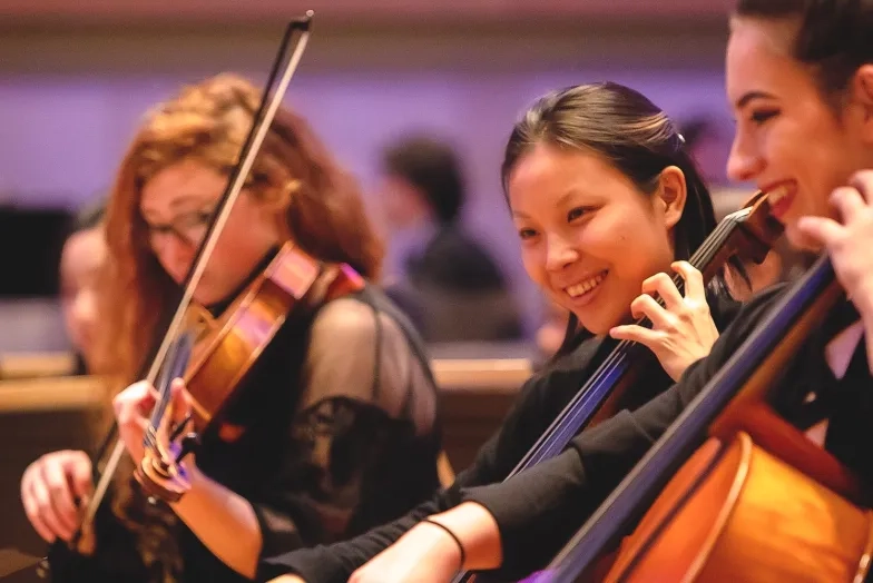 DegreesAndPrograms-Strings-Cello-Herov2-6.jpeg A photo of a female SFCM student playing cello