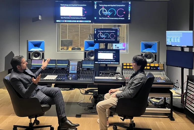 Ricky Kej works with a student in Studio G. Ricky Kej works with a student in Studio G.