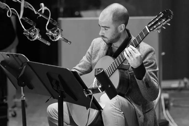 SFCM alum playing guitar