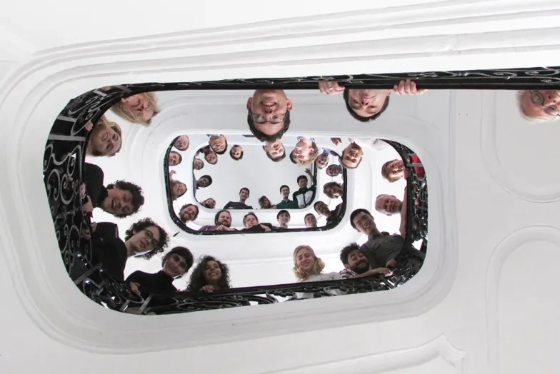 Students looking down staircase in paris