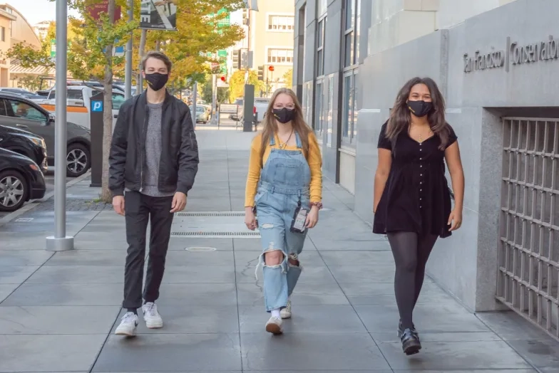 SFCM students wearing masks outside 50 Oak building
