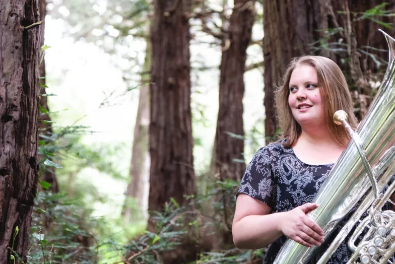SFCM Student Playing Tuba in the forest