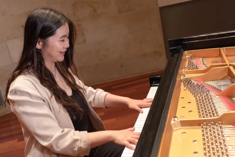 student at piano