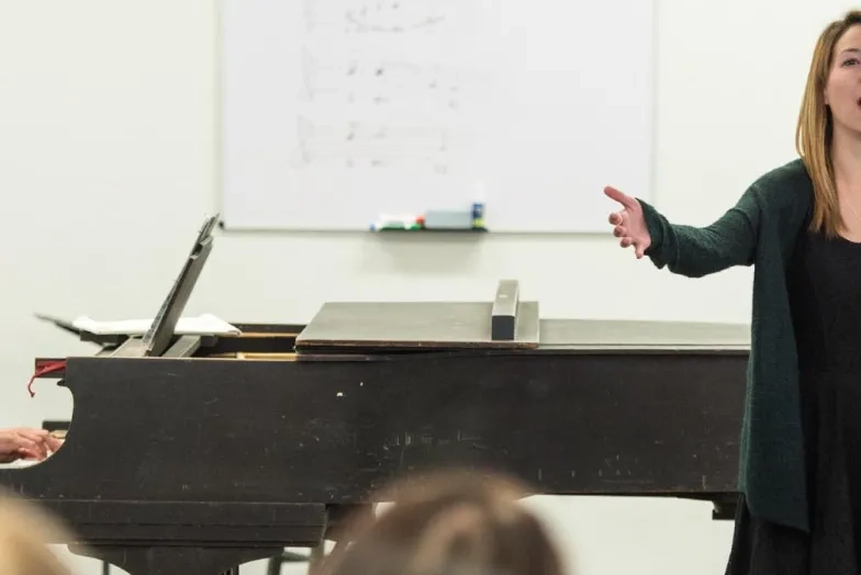 a vocalist singing with piano accompaniment