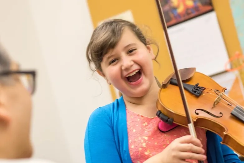 SFCM Early Childhood student playing violin