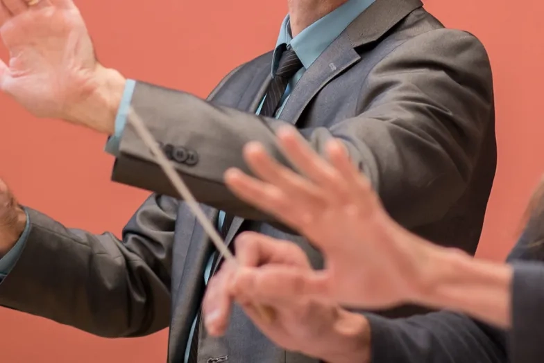 student in a conducting lesson with a professor