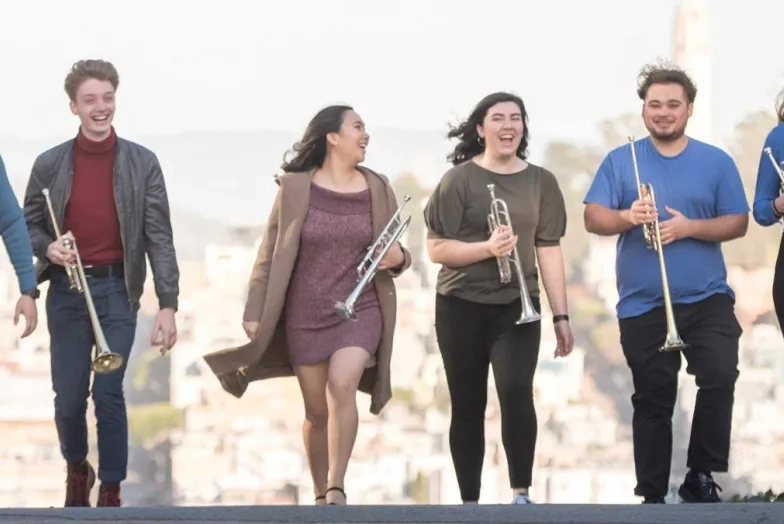 Students walking outside with instruments in San Francisco