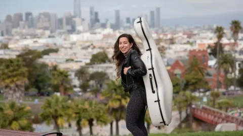 Strings cello outside gigging in city