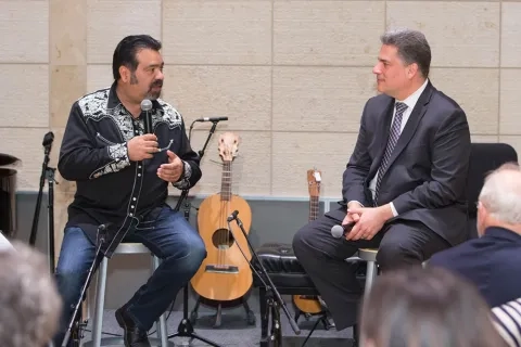 David Stull speaking with guest