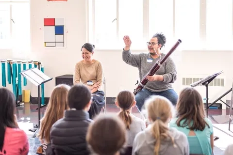 SFCM student teaching young students at school (Conservatory in the Schools)