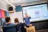Professor giving a lecture in the SFCM TAC Lab during Winter Term 2018